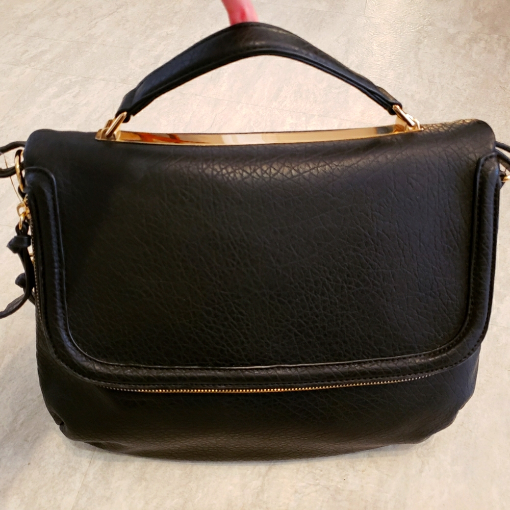 Black faux leather messenger bag with gold accents
